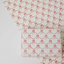 Papel regalo algodón 50x70cm - Lazos rosas