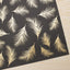 Papel regalo plumas doradas 100x70cm